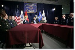 President George W. Bush sits with U.S. Air Force Senior Airman Rebecca Blascak, left, and U.S. Army Sgt. First Class Kenneth Williams, right, as he meets with military personnel Wednesday, June 28, 2006, at the VFW Overland-St. Ann Memorial Post #3944 in St. Louis, Mo., who recently have returned from Iraq and Afghanistan. White House photo by Kimberlee Hewitt