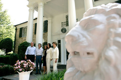 President George W. Bush, Laura Bush and Japanese Prime Minister Junichiro Koizumi are welcomed to Graceland, the home of Elvis Presley, by his former wife Priscilla Presley and their daughter Lisa-Marie Presley, Friday, June 30, 2006 in Memphis. White House photo by Eric Draper