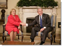 President George W. Bush welcomes President Michelle Bachelet of Chile to the Oval Office Thursday, June 8, 2006. White House photo by Kimberlee Hewitt