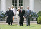President George W. Bush walks with former Idaho Gov. Dirk Kempthorne prior to his swearing-in ceremony as the new U.S. Secretary of Interior by Supreme Court Justice Antonin Scalia, left, Wednesday, June 7, 2006 on the South Lawn of the White House in Washington. Patricia Kempthorne, center, who held the Bible during her husband’s swearing-in, is joined by their children Heather Myklegard and son, Jeff Kempthorne. White House photo by Kimberlee Hewitt