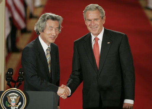 President George W. Bush shakes hands with Japan’s Prime Minister Junichiro Koizumi at the conclusion of their joint press availability Thursday, June 29, 2006, in the East Room of the White House. White House photo by Paul Morse