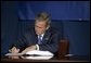  President George W. Bush signs the Convention for the Suppression of Acts of Nuclear Terrorism Treaty at the United Nations in New York Wednesday, Sept. 14, 2005. White House photo by Eric Draper