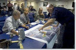 President George W. Bush, joined by New Orleans Mayor C. Ray Nagin, is given a briefing by U.S. Army Lt. General Russel L. Honore and U.S. Coast Guard Vice Admiral Thad W. Allen, Monday, Sept. 12, 2005 at the operations center in New Orleans, La. White House photo by Paul Morse