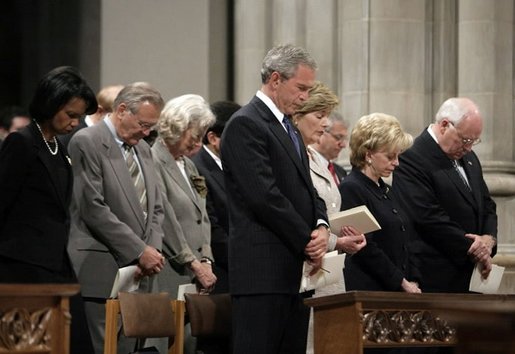 President George W. Bush bows his head in prayer during the National Day of Prayer and Remembrance Service at the Washington National Cathedral in Washington, D.C., Friday, Sept. 16, 2005. Also pictured are Laura Bush, Lynne Cheney Vice President Cheney, Secretary Rice and Secretary Rumsfeld. White House photo by Eric Draper