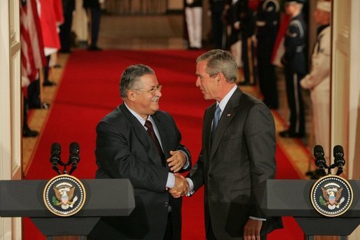 President George W. Bush shakes hands with President Jalal Talabani of Iraq after their joint press availability Tuesday, Sept. 13, 2005, in the East Room of the White House. White House photo by Shealah Craighead