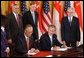 President George W. Bush and Singapore Prime Minister Chok Tong Goh sign a free trade agreement in the East Room Tuesday, May 6, 2003. White House photo by Tina Hager