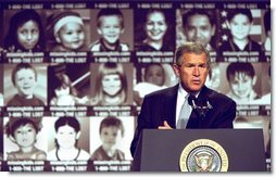  President George W. Bush addresses participants in the first-ever White House Conference on Missing, Exploited, and Runaway Children Wednesday, October 2,2002 at the Ronald Reagan Building and International Conference Center in Washington, D.C. The event helped raise public awareness of steps that parents, law enforcement, and communities can take to make America's children safer.  White House photo by Paul Morse