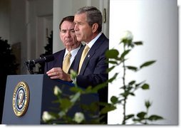 President George W. Bush announces the administration's new rule on generic drugs in the Rose Garden Monday, Oct. 21. Standing with the President is Secretary of Health and Human Services Tommy Thompson. "By this action, we will reduce the cost of prescription drugs in America by billions of dollars and ease a financial burden for many citizens, especially our seniors," explained the President. White House photo by Tina Hager.