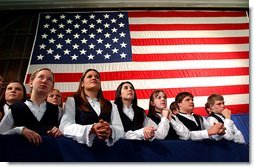 Members of the Hampden Academy Chamber Choir listen to President George W. Bush during the Maine Welcome in Bangor, Maine, Tuesday, Oct. 22. White House photo by Eric Draper.