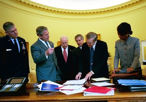 During his morning briefing, President George W. Bush reviews the progress of the war with members of the War Council Wednesday, April 2, 2003. Pictured with the President are, from left, Chairman of the Joint Chiefs of Staff Richard B. Myers, Vice President Dick Cheney, Chief of Staff Andy Card, Secretary of Defense Donald Rumsfeld and National Security Advisor Condoleezza Rice. White House photo by Eric Draper