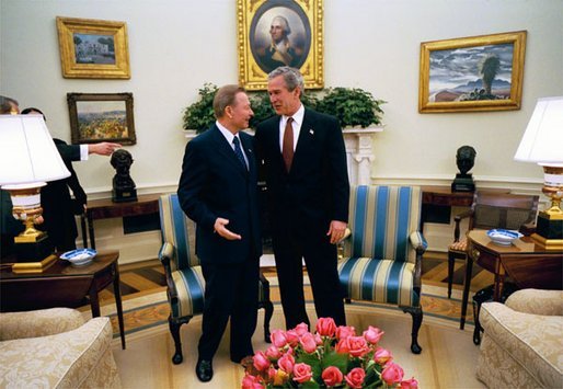 President George W. Bush talks with President Rudolf Schuster of the Slovak Republic in the Oval Office Wednesday, April 9, 2003. A member of the coalition bringing freedom to Iraq, Slovakia is contributing a nuclear/biological/chemical weapons team that is based in Kuwait. White House photo by Eric Draper.