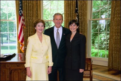 President George W. Bush and Laura Bush congratulate 2003 Maine Teacher of the Year Denise Tanner in the Oval Office Wednesday, April 30, 2003. White House Photo by Eric Draper