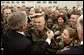 President George W. Bush provides a little touch-up on a soldier’s haircut as he greets military personnel at Wright-Patterson Air Force Base in Dayton, Ohio, April 24, 2003. White House photo by Paul Morse