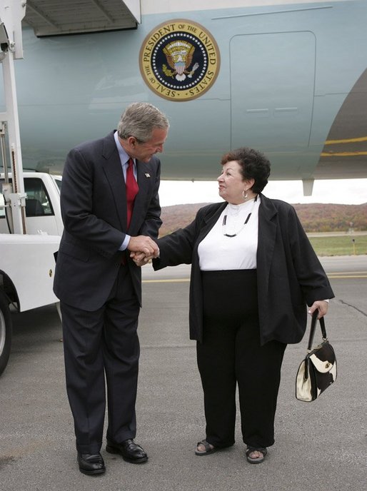 President George W. Bush talks with USA Freedom Corps Greeter Dolly Yunkunis in front of Air Force One in Wilkes-Barre, Pennsylvania, Friday, Oct. 22, 2004. White House photo by Eric Draper.