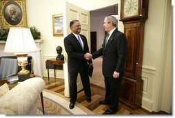 President George W. Bush welcomes U.S. Coast Guard Rear Admiral Stephen W. Rochon to the Oval Office Tuesday, Feb. 20, 2007. The New Orleans native was announced Tuesday, Feb. 27, 2007, as Director of the Executive Residence and Chief Usher. He will be the eighth Chief Usher of the White House. White House photo by Eric Draper