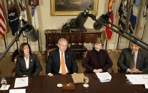 President George W. Bush, joined by Mrs. Laura Bush, talks with reporters during a briefing on volunteerism in the Roosevelt Room at the White House, Tuesday, Feb. 13, 2007, seen with Jean Case, chair of the President’s Council on Service and Civic Participation, and Bob Goodwin, president and CEO of Points of the Light Foundation and Volunteer Center National Network. White House photo by Eric Draper