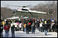 A crowd waves at the lift-off of Marine One carrying President George W. Bush and Mrs. Laura Bush, following their visit to the Mount Vernon Estate of President George Washington, Monday Feb. 19, 2007 in Mount Vernon, Va., in honor of President Washington’s 275th birthday. White House photo by Eric Draper