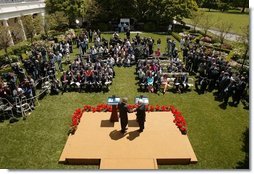 President George W. Bush and President Mahmoud Abbas of the Palestinian Authority, shake hands after a joint press availability in the Rose Garden of the White House Thursday, May 26, 2005.  White House photo by Paul Morse