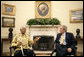 President George W. Bush greets former President Nelson Mandela of South Africa in the Oval Office Tuesday, May 17, 2005. White House photo by Eric Draper