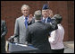 President George W. Bush attends the swearing-in ceremony of Air Force Lt. Gen. Michael V. Hayden, center, as Deputy Director of National Intelligence at the New Executive Office Building Wednesday, May 18, 2005. White House photo by Eric Draper