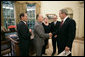 President George W. Bush meets with representatives of the Cuban-American Community in the Oval Office to discuss pro-democracy efforts in Cuba Friday, May 20, 2005. Pictured are, from left: Eleno Oviedo of Sunrise, Fla.; Luis Zuniga of Miami; Caridad Roque of Miami; and Emilio Estefan of Miami. White House photo by Eric Draper