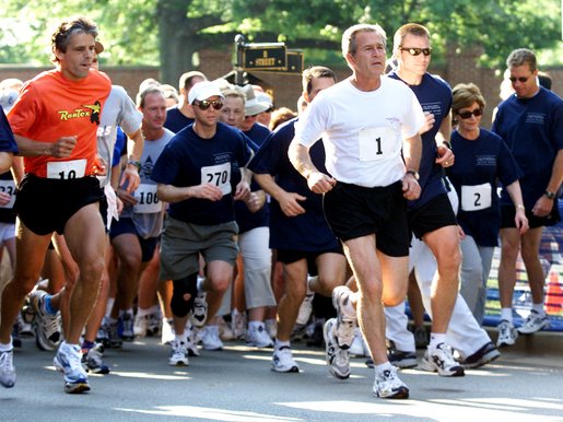 President George W. Bush competes in the 3 mile run as part of The President's Fitness Challenge at Ft. McNair on Saturday June 21, 2002. 