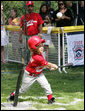 A player for the Cramer Hill Little League Rex Sox of Camden, N.J. hits the ball during the season opening game of the 2008 Tee Ball on the South Lawn Monday, June 30, 2008, on the South Lawn of the White House playing against the Jose M. Rodriguez Little League Angels of Manati, Puerto Rico. White House photo by Chris Greenberg