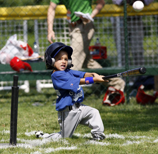 A player of the Jose M. Rodriguez Little League Angels from Manati, Puerto Rico hits the ball during the 2008 Tee Ball on the South Lawn Season Opener Monday, June 30, 2008, on the South Lawn of the White House. White House photo by Eric Draper