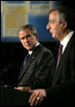 President George W. Bush listens to Argentina's President Nestor Carlos Kirchner as the two hold a joint press availability Friday, Nov. 4, 2005, at the Hermitage Hotel in Mar del Plata, Argentina. White House photo by Eric Draper