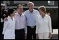 President George W. Bush and Colombian President Alvaro Uribe pose with their wives, U.S. first lady Laura Bush (R) and Colombia first lady Lina Moreno at the President's Central Texas ranch in Crawford, Texas, on August 4, 2005. White House photo by Paul Morse