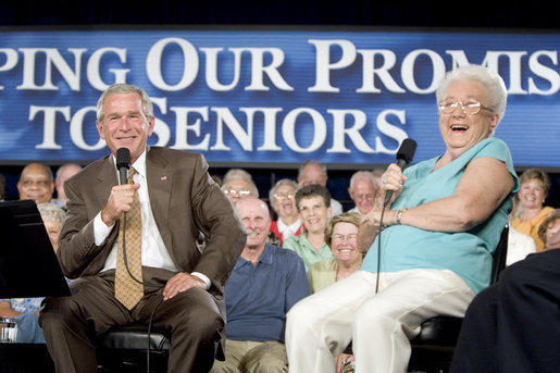 President George W. Bush shares a laugh with 82-year-old Margaret Cantrell of Scottsdale, during a Conversation on Medicare Monday, Aug. 29, 2005, at the Pueblo El Mirage RV Resort and Country Club in nearby El Mirage, Ariz. White House photo by Paul Morse
