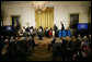 President George W. Bush and Mrs. Laura Bush watch as the St. Veronicas Youth Steel Orchestra performs at the Helping America's Youth Event Thursday Feb. 7, 2008, in the East Room of the White House. White House photo by Shealah Craighead