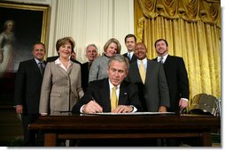 President George W. Bush signs an Executive Order establishing the Interagency Working Group on Youth Programs at the Helping America's Youth Event Thursday Feb. 7, 2008, in the East Room of the White House. The Executive Order is a coalition of Federal agencies that will help support communities and organizations working to help our Nation's youth. White House photo by Chris Greenberg