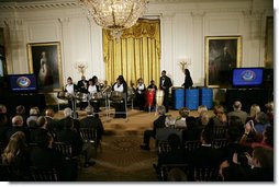 President George W. Bush and Mrs. Laura Bush watch as the St. Veronicas Youth Steel Orchestra performs at the Helping America's Youth Event Thursday Feb. 7, 2008, in the East Room of the White House. White House photo by Shealah Craighead