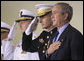 President George W. Bush participates in the Change of Command Ceremony for the Commandant of the U.S. Coast Guard Thursday, May 25, 2006. He stands onstage with General Peter Pace, Chairman, Joint Chiefs of Staff, and Admiral Thad Allen, the 23rd Commandant. White House photo by Eric Draper