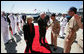 Vice President Dick Cheney and his wife Lynne Cheney is greeted by officers from the amphibious assault ship USS Bonhomme Richard. The vice president spoke to over 4,000 sailors and Marines and thanked them and their families for their service to the country. White House photo by David Bohrer