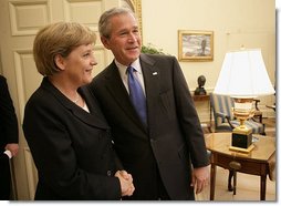 President George W. Bush welcomes German Chancellor Angela Merkel to the Oval Office at the White House, Wednesday, May 3, 2006. White House photo by Eric Draper