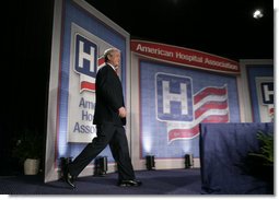 President George W. Bush steps onto the stage at the Washington Hilton Hotel Monday, May 1, 2006, prior to delivering his remarks on health care initiatives. Said the President, "America has the best health care system in the world, pure and simple." White House photo by Paul Morse