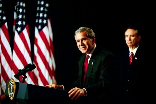 As Health and Human Services Secretary Tommy Thompson stands by, President George W. Bush discusses Medicare in the Dwight D. Eisenhower Executive Office Building Tuesday, Oct. 29, 2003. "The best way to provide our seniors with modern medicine, including prescription drug coverage and better preventative care, is to give them better choices under Medicare," said the President talking about pending Medicare legislation White House photo by Tina Hager