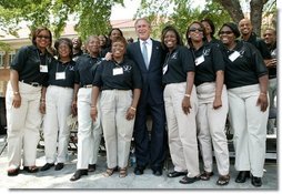 President George W. Bush poses for a photograph with the 16th Street Baptist Church Choir of Birmingham, Ala., at the Brown V. Board of Education National Historic Site in Topeka, Kan., Monday, May 17, 2004.  White House photo by Eric Draper