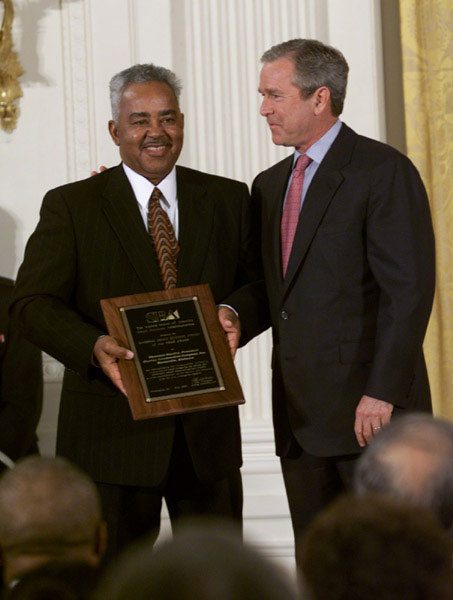 President George W. Bush stands with Thornton Stanley of Stanley Construction, Huntsville, Alabama who holds his award for the Small Business Person of the Year during a ceremony in the East Room, Tuesday, May 8. WHITE HOUSE PHOTO BY ERIC DRAPER