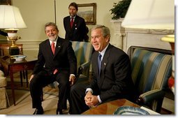 President George W. Bush and President Luiz Inacio Lula da Silva of Brazil address the media in the Oval Office Friday, June 20, 2003. "This is the third meeting I will have held with the President. It shows how important our relationship is," said President Bush. "Brazil is an incredibly important part of a peaceful and prosperous North and South America. I can say that from the perspective of the United States, this relationship is a vital and important and growing relationship."  White House photo by Paul Morse
