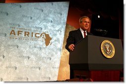 President George W. Bush addresses the Corporate Council on Africa's U.S.- Africa Business Summit in Washington, D.C., Thursday, June 27, 2003. "All of us here today share some basic beliefs. We believe that growth and prosperity in Africa will contribute to the growth and prosperity of the world. We believe that human suffering in Africa creates moral responsibilities for people everywhere. We believe that this can be a decade of unprecedented advancement for freedom and hope and healing and peace across the African continent," President Bush said.  White House photo by Paul Morse