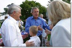 President George W. Bush greets guests at the Congressional Picnic on the South Lawn Wednesday, June 18, 2003.  White House photo by Susan Sterner