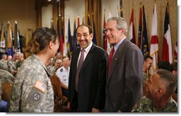 President George W. Bush and Iraqi Prime Minister Nouri al-Maliki meet with military personnel during their visit to Fort Belvoir, Va., Wednesday, July 26, 2006.  White House photo by Paul Morse
