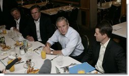 President George W. Bush meets business leaders and his brother, Florida Governor Jeb Bush, left, in Miami at the Versailles Restaurant and Bakery for a breakfast meeting Monday, July 31, 2006. White House photo by Kimberlee Hewitt