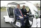 President George W. Bush is escorted by President Vladimir Putin of Russia, as they drive an electric GEM car to the Bilateral Meeting Room at the Konstantinovsky Palace Complex, site of the G8 Summit Saturday, July 15, 2006, in Strelna, Russia. White House photo by Eric Draper