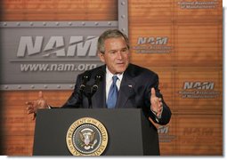 President George W. Bush gestures as he addresses the National Association of Manufacturers on the strength of the U.S. economy Thursday, July 27, 2006, at the Grand Hyatt hotel in Washington, D.C. White House photo by Paul Morse