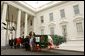 Laura Bush receives the official White House Christmas Tree, a Noble Fir, from the Hedlund Family of Elma, Wash., at the North Portico of the White House Dec. 2. The Hedlund family was the winner of the National Christmas Tree Association's "Grand Champion" grower contest. White House photo by Tina Hager.