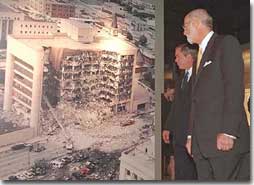 President George W. Bush looks at a photo of the Oklahoma City Murrah Federal Building bombing at the Oklahoma City National Memorial February 19, 2001. The President attended the dedication ceremony of the memorial. (White House Photo by Paul Morse)